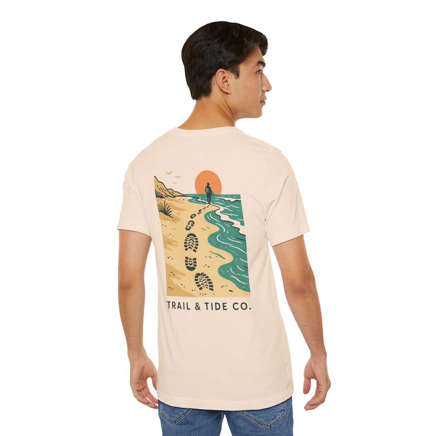 Tidewalker Tee | Coastal Trail Footprints Along Sunset Shore - Beach Walk Graphic Back Tee with Front Crest Patch (BC3001)