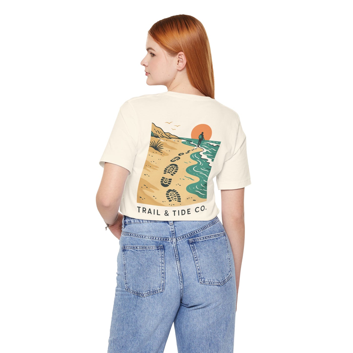 Tidewalker Tee | Coastal Trail Footprints Along Sunset Shore - Beach Walk Graphic Back Tee with Front Crest Patch (BC3001)