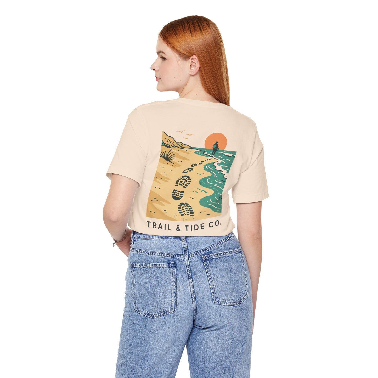 Tidewalker Tee | Coastal Trail Footprints Along Sunset Shore - Beach Walk Graphic Back Tee with Front Crest Patch (BC3001)