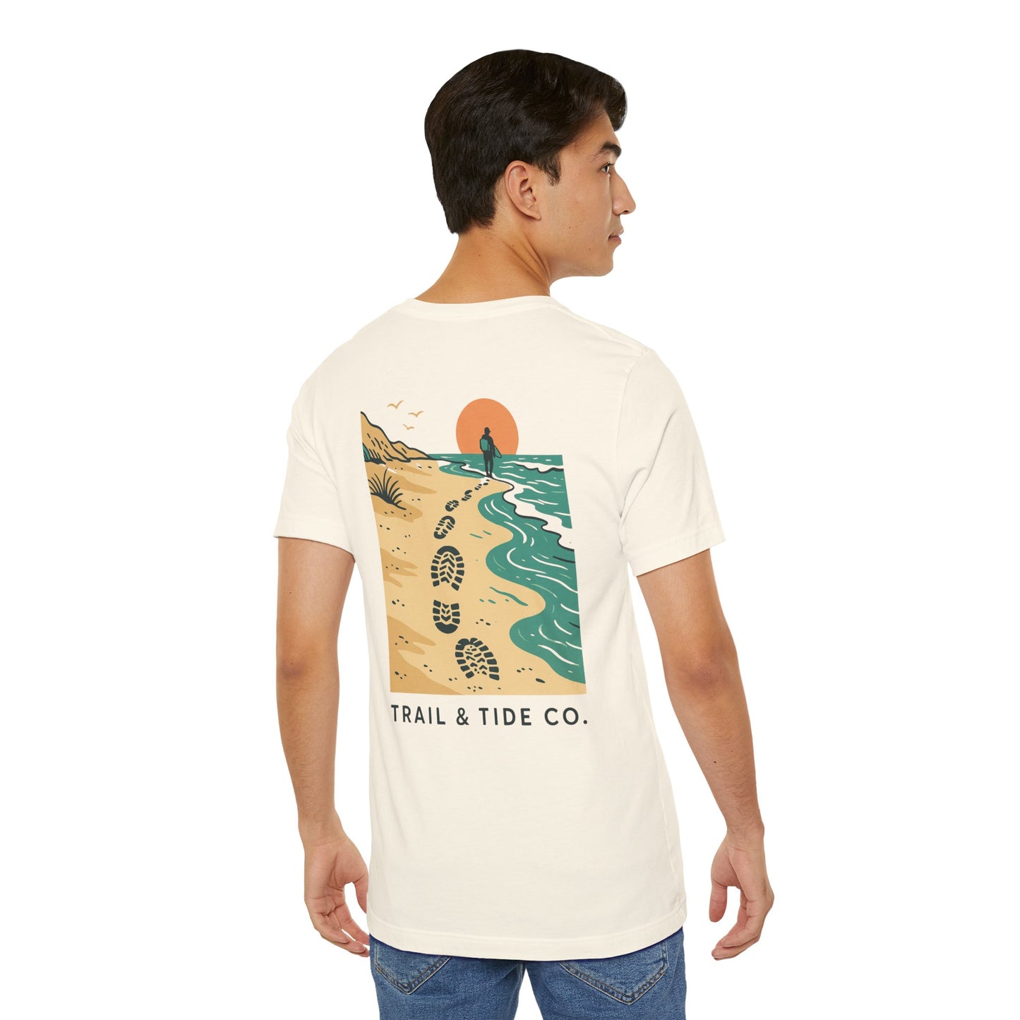 Tidewalker Tee | Coastal Trail Footprints Along Sunset Shore - Beach Walk Graphic Back Tee with Front Crest Patch (BC3001)